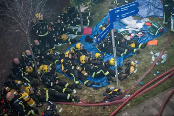 Heroes! Photo Of Firefighters Looking Very Tired After Putting Off The Grenfell Towers Fire